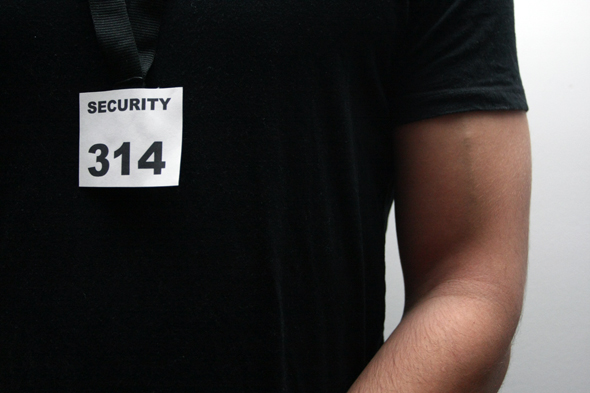 A tight-crop photo of a security guard.
