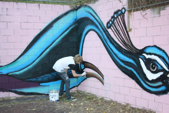 Joel Fergie painting one of his artworks
