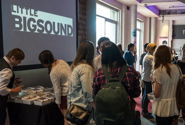 Attendees of Little BIGSOUND 2012 collecting welcome packs