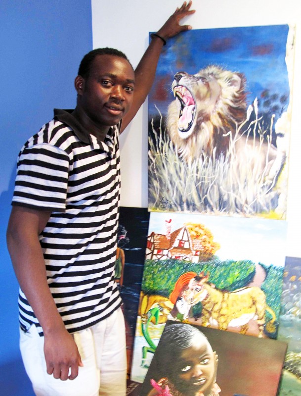 Kiny Ruharara's with his colourful paintings.