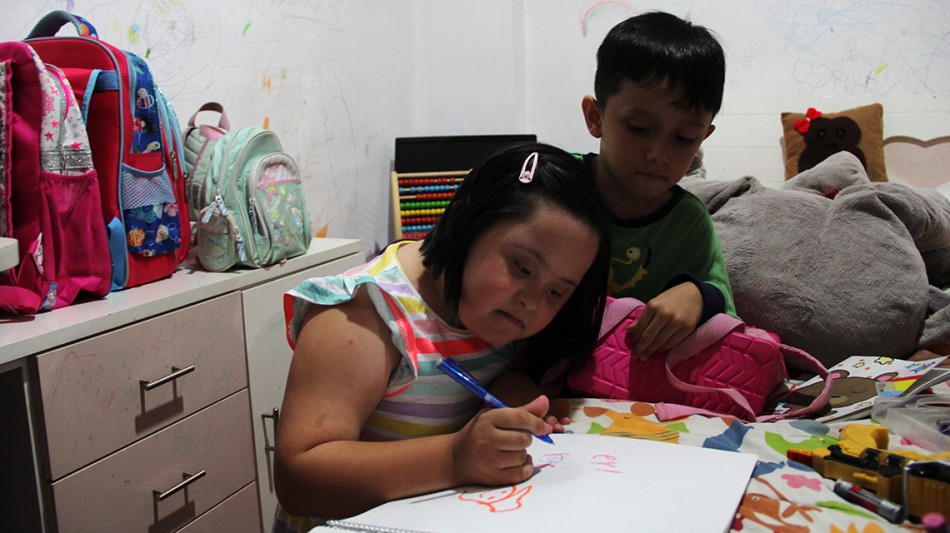 Evi showed us her drawing skills as her younger brother, Adam, helped her.