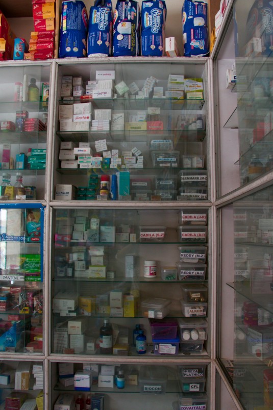 Medications piled in cupboards ready for purchase.