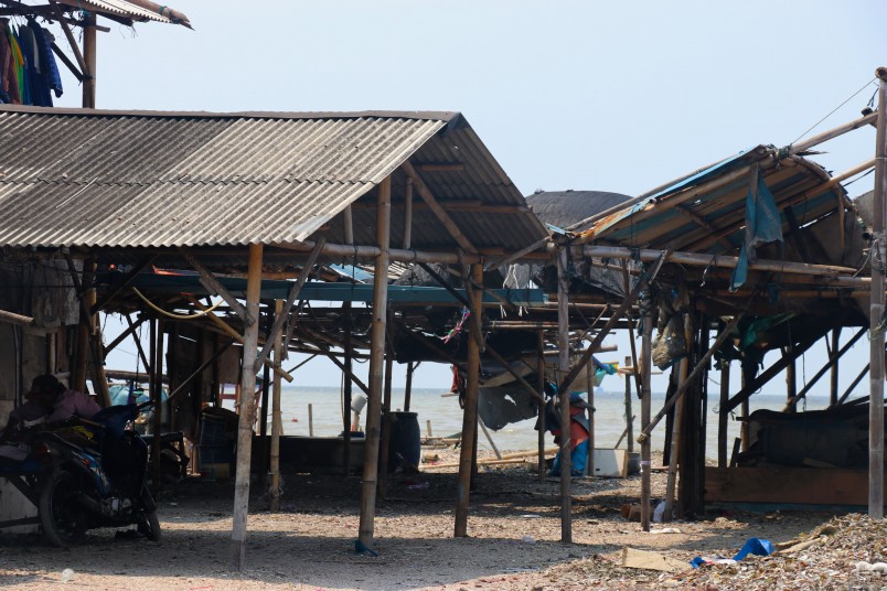 Huts in Muara Angke where fishermen bring their boats and catch in
