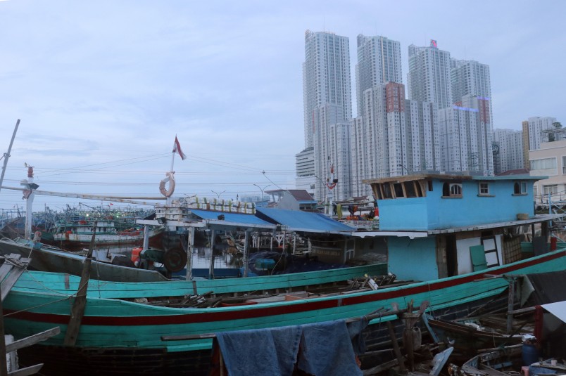 An interesting contrast between the traditional Indonesian fishing boats and the rapidly growing high-rise 