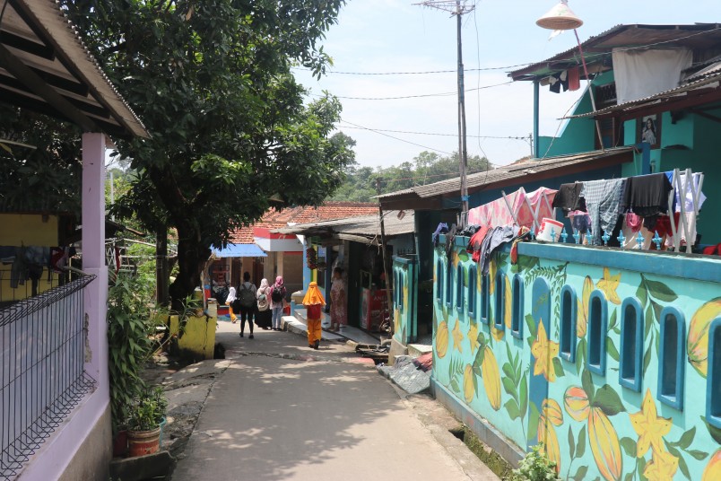 The streets of Depok, near Universitas Indonesia, where many people have created small gardens, often encroaching onto the road and the occasional house still has a mature tree